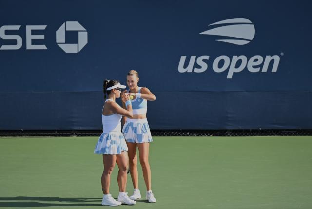 (260904) -- NEW YORK, Sept. 4, 2026 (Xinhua) -- Guo Hanyu(L)/Kristina Mladenovic talk during the women's doubles first round match between Guo Hanyu(China)/Kristina Mladenovic(France) and Maja Chwalinska/Madga Linette of Poland at the 2026 US Open tennis championships in New York, the United States, Sept. 3, 2026. (Xinhua/Li Rui)