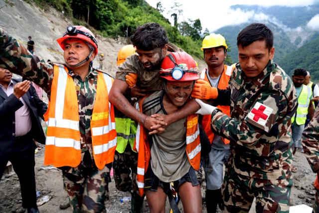 (260904) -- KATHMANDU, Sept. 4, 2026 (Xinhua) -- Rescuers transfer a worker rescued alive in Rasuwa district, Nepal, Sept. 4, 2026. Two men trapped inside the tunnel of the Trishuli 3A hydropower project, which was badly affected by last week's deadly mudslide, were rescued alive on Friday, the Nepali Army said. (Nepali Army/Handout via Xinhua)