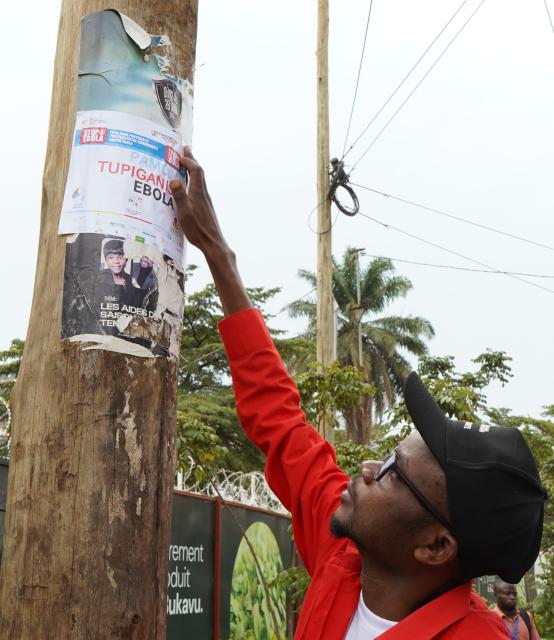 (260904) --BUKAVU, Sept. 4, 2026 (Xinhua) -- A staff member puts up a poster on Ebola prevention knowledge in Bukavu, eastern Democratic Republic of the Congo, Sept. 3, 2026. The Africa Centers for Disease Control and Prevention (Africa CDC) said Thursday it remains too early to say that the Ebola outbreak in the Democratic Republic of the Congo (DRC) is under control, despite signs of stabilization in recent weeks. (Xinhua)