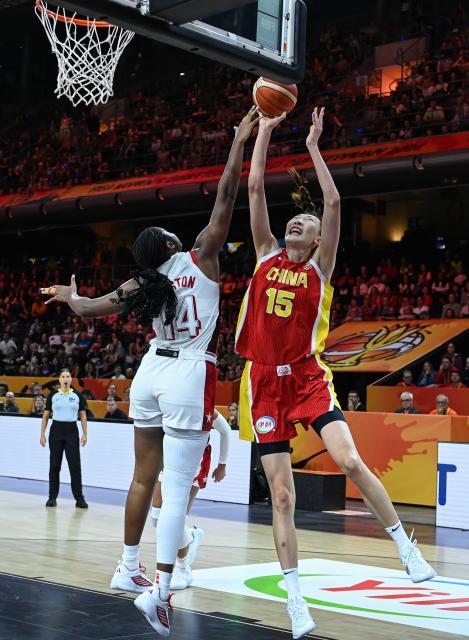 (260904) -- BERLIN, Sept. 4, 2026 (Xinhua) -- Han Xu (R) of China shoots against Aliyah Boston of the United States during the group D match between China and the United States at the FIBA Women's Basketball World Cup 2026 in Berlin, Germany, Sept. 4, 2026. (Xinhua/Zhang Haofu)