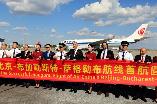 (260904) -- BUCHAREST, Sept. 4, 2026 (Xinhua) -- People pose for a group photo after the arrival of Air China's CA914 flight at Henri Coanda International Airport near Bucharest, Romania, Sept. 4, 2026. Air China launched its maiden Beijing-Bucharest-Zagreb flight on Friday, restoring direct passenger links between China and Romania after more than two decades and inaugurating the first-ever scheduled passenger service between China and Croatia. (Photo by Cristian Cristel/Xinhua)