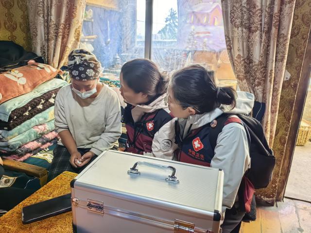 (260905) -- GYIRONG, Sept. 5, 2026 (Xinhua) -- Counselors provide psychological support for a villager in Gyirong County, southwest China's Xizang Autonomous Region, Sept. 3, 2026.
  TO GO WITH "Letter from Gyirong: A flag, a ruin and a promise to bring them home" (Mental Health Center of West China Hospital of Sichuan University/Handout via Xinhua)