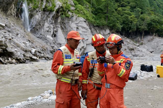 (260905) -- GYIRONG, Sept. 5, 2026 (Xinhua) -- Rescuers inspect the mudslide-hit G216 national highway and its surrounding area via a drone in Gyirong County, southwest China's Xizang Autonomous Region, Sept. 2, 2026.
  TO GO WITH "Letter from Gyirong: A flag, a ruin and a promise to bring them home" (Xinhua/Zhou Yulong)