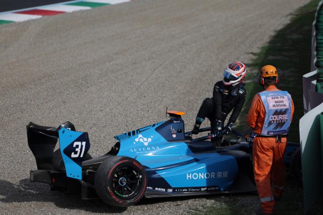 (260905) -- MONZA, Sept. 5, 2026 (Xinhua) -- Dams Lucas Oil driver Gerrard Xie (L) of China leaves the circuit after crashing with Hitech driver Shin Woohyun of South Korea during the sprint race of the Formula 3 Italian Grand Prix at Monza Circuit, near Milan, Italy, on Sept. 5, 2026. (Xinhua/Li Jing)
