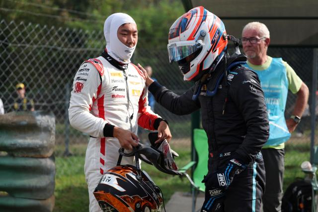 (260905) -- MONZA, Sept. 5, 2026 (Xinhua) -- Dams Lucas Oil driver Gerrard Xie (R) of China reacts after crashing with Hitech driver Shin Woohyun of South Korea during the sprint race of the Formula 3 Italian Grand Prix at Monza Circuit, near Milan, Italy, on Sept. 5, 2026. (Xinhua/Li Jing)