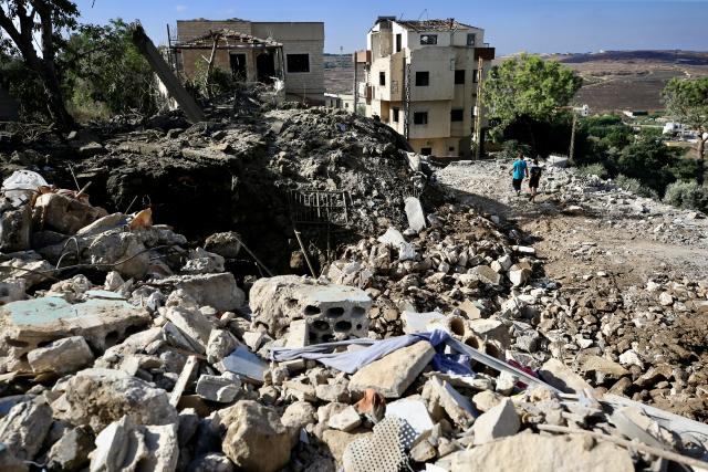 (260905) -- MAYFADOUN, Sept. 5, 2026 (Xinhua) -- People inspect the destruction from Israeli airstrikes that led to the death of a woman in Mayfadoun, southern Lebanon, Sept. 5, 2026. A Lebanese woman was killed and five other people injured Saturday in Israeli airstrikes targeting towns in southern Lebanon, according to Lebanon's official National News Agency (NNA). (Photo by Ali Hashisho/Xinhua)