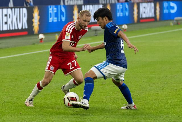 (260906) -- GELSENKIRCHEN, Sept. 6, 2026 (Xinhua) -- Tanaka Satoshi (R) of FC Schalke 04 vies with Konrad Laimer of FC Bayern Munich during the German first division Bundesliga football match between FC Schalke 04 and FC Bayern Munich in Gelsenkirchen, Germany, Sept. 5, 2026. (Photo by Joachim Bywaletz/Xinhua)