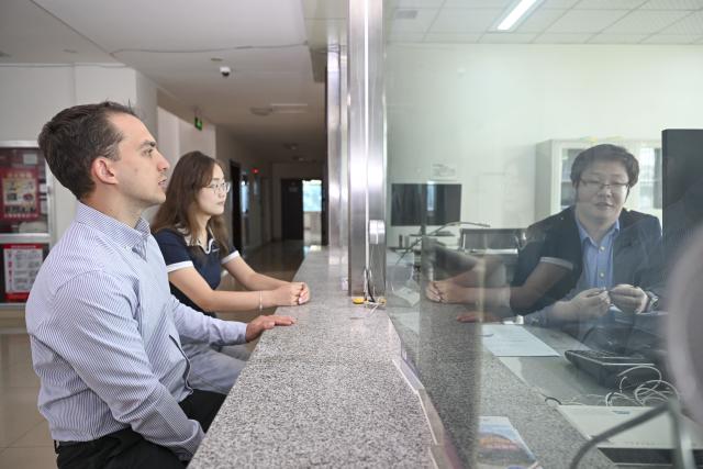 (260906) -- URUMQI, Sept. 6, 2026 (Xinhua) -- Arseniy Kretov (L) and his Chinese partner handle business at the Urumqi cargo terminal of China United International Rail Containers Co., Ltd. (CRIntermodal) in Urumqi, northwest China's Xinjiang Uygur Autonomous Region, Sept. 2, 2026.
  Arseniy Kretov, 27, who goes by the Chinese name Yu Hao, hails from Tashkent, Uzbekistan. He is the regional representative of O'ZTEMIRYO'LKONTEYNER (UTK) in China and mainly works in cross-border logistics. 
  Interested in China, Arseniy went to Nanjing in Jiangsu Province to study. During his three years there, he was deeply impressed by China's transportation, medical services and food. After starting his career, UTK dispatched Arseniy to Xinjiang because he was fluent in Chinese. 
  Arseniy currently works with a Chinese team in Urumqi. His company transports consumer goods, electronic products, fabrics and other products made in China to countries in Central Asia and elsewhere. 
  Although Arseniy has worked in Xinjiang for less than a year, he has already found many market opportunities. His team's business volume has increased every month, which has given him more confidence. Arseniy said logistics between China and Central Asia is more than just a job for him. It is a field with promising prospects. (Xinhua/Hu Huhu)