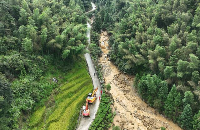 (260906) -- JI'AN, Sept. 6, 2026 (Xinhua) -- An aerial drone photo taken on Sept. 6, 2026 shows rescuers working in Mingkeng Village of Suichuan County, Ji'an City, east China's Jiangxi Province. Three people have been confirmed dead and nine others remain missing after a mudslide and landslide struck the city of Ji'an in east China's Jiangxi Province on Saturday morning. (Xinhua/Wan Xiang)