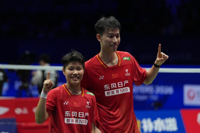 (260906) -- SHENZHEN, Sept. 6, 2026 (Xinhua) -- Feng Yanzhe (R)/Huang Dongping of China pose after winning the mixed doubles final match against Hoo Pang Ron/Lai Pei Jing of Malaysia at China Masters 2026 badminton tournament in Shenzhen, south China's Guangdong Province, Sept. 6, 2026. (Xinhua/Sun Fei)