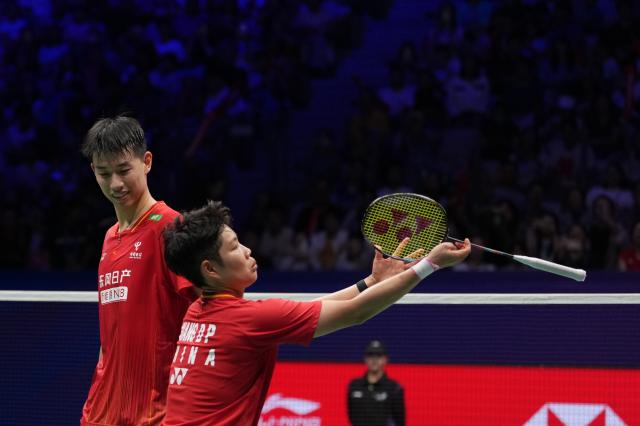 (260906) -- SHENZHEN, Sept. 6, 2026 (Xinhua) -- Feng Yanzhe (L)/Huang Dongping of China react after winning the mixed doubles final match against Hoo Pang Ron/Lai Pei Jing of Malaysia at China Masters 2026 badminton tournament in Shenzhen, south China's Guangdong Province, Sept. 6, 2026. (Xinhua/Sun Fei)