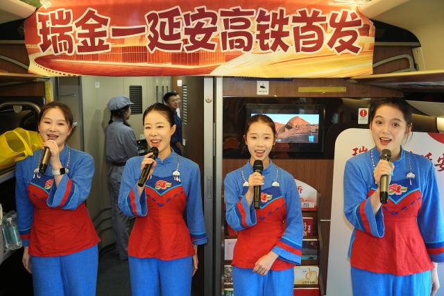 (260906) -- RUIJIN, Sept. 6, 2026 (Xinhua) -- Actresses perform on the first high-speed train from Ruijin in east China's Jiangxi Province to Yan'an in northwest China's Shaanxi Province, Sept. 6, 2026. With the departure of high-speed train G3998 from Ruijin Station heading for Yan'an on Sunday morning, the two sacred revolutionary sites were directly linked by high-speed rail service for the first time.
  This year marks the 90th anniversary of the victory of the Central Red Army's Long March. Ruijin and Yan'an, serving as the starting point of the Long March and the revolutionary heartland of the Communist Party of China after the Long March, are located in east and northwest China, respectively. (Xinhua/Shao Rui)