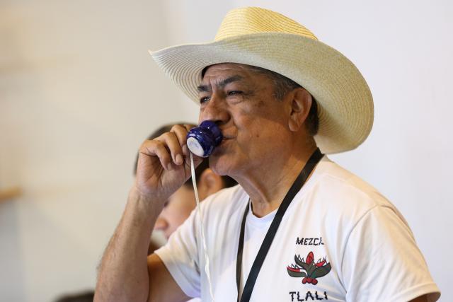 (260906) -- MEXICO CITY, Sept. 6, 2026 (Xinhua) -- A man takes part in a tasting during the Pulque, Traditional Cuisine and Mezcal Festival in Mexico City, capital of Mexico, Sept. 5, 2026. The event, featuring more than 100 varieties and expressions of agave-based beverages, as well as tastings, food pairings and other activities, was held in Mexico City on Saturday. (Photo by Francisco Canedo/Xinhua)