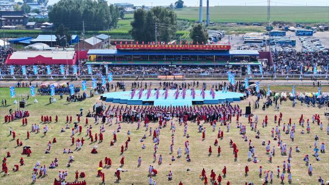 (260906) -- DORBOD, Sept. 6, 2026 (Xinhua) -- A drone photo taken on Sept. 6, 2026 shows a scene during the opening ceremony of a Nadam fair in the Mongolian Autonomous County of Dorbod, Daqing City, northeast China's Heilongjiang Province. The event was held here on Sunday. It featured cultural performances and folk activities, offering tourists and local residents a celebration of grassland culture. (Photo by Xu Shuai/Xinhua)