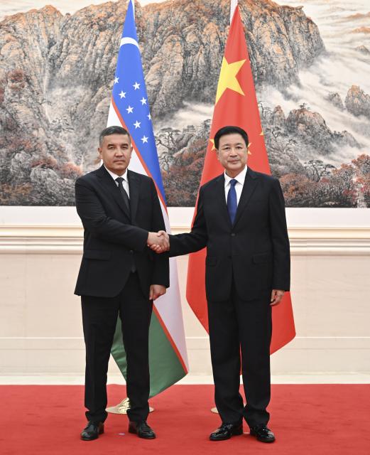 (260906) -- BEIJING, Sept. 6, 2026 (Xinhua) -- Chinese Minister of Public Security Wang Xiaohong, also a member of the Secretariat of the Communist Party of China Central Committee, meets with Uzbekistan's Minister of Internal Affairs Aziz Tashpulatov in Beijing, capital of China, Sept. 6, 2026. (Xinhua/Zhang Ling)