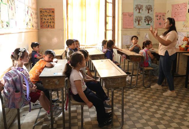 (260906) -- DAMASCUS, Sept. 6, 2026 (Xinhua) -- Students attend a class on the first day of the new school year at a school in Damascus, Syria, Sept. 6, 2026. TO GO WITH "Feature: Syrian families count cost of back-to-school season amid economic strain" (Photo by Ammar Safarjalani/Xinhua)