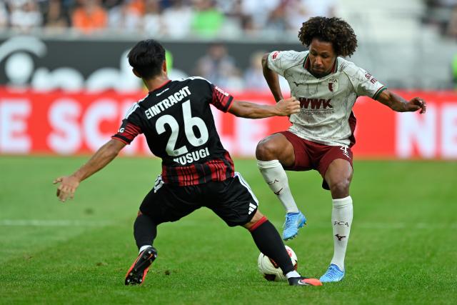 (260907) -- FRANKFURT, Sept. 7, 2026 (Xinhua) -- Kosugi Keita (L) of Eintracht Frankfurt vies with Han-Noah Massengo of FC Augsburg during the German first division Bundesliga football match between Eintracht Frankfurt and FC Augsburg in Frankfurt, Germany, Sept. 6, 2026. (Photo by Ulrich Hufnagel/Xinhua)