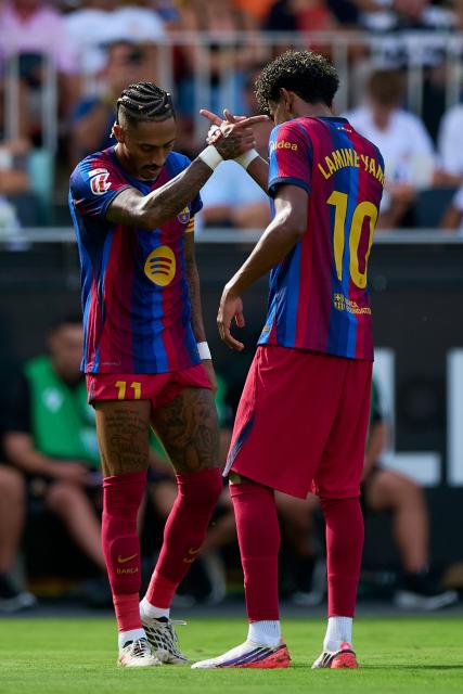 (260907) -- VALENCIA, Sept. 7, 2026 (Xinhua) -- Barcelona's Lamine Yamal (R) and Raphinha celebrate a goal during the Spanish La Liga football match between Valencia CF and FC Barcelona in Valencia, Spain, Sept. 6, 2026. (Str/Xinhua)