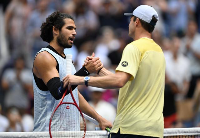 (260907) -- NEW YORK, Sept. 7, 2026 (Xinhua) -- Carlos Alcaraz (L) of Spain shakes hands with Tommy Paul of the United States after their men's singles fourth round match at the 2026 US Open tennis championships in New York, the United States, Sept. 6, 2026. (Xinhua/Li Rui)