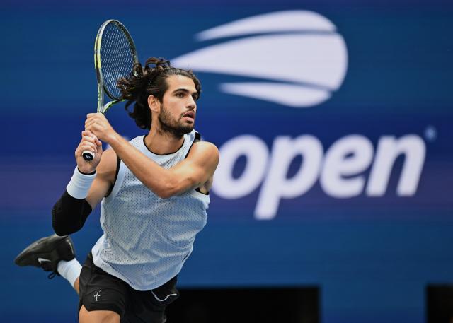 (260907) -- NEW YORK, Sept. 7, 2026 (Xinhua) -- Carlos Alcaraz of Spain hits a return during the men's singles fourth round match between Carlos Alcaraz of Spain and Tommy Paul of the United States, at the 2026 US Open tennis championships in New York, the United States, Sept. 6, 2026. (Xinhua/Li Rui)