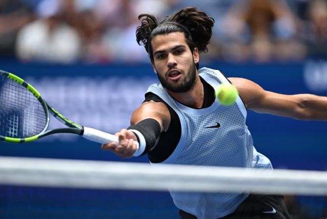 (260907) -- NEW YORK, Sept. 7, 2026 (Xinhua) -- Carlos Alcaraz of Spain hits a return during the men's singles fourth round match between Carlos Alcaraz of Spain and Tommy Paul of the United States, at the 2026 US Open tennis championships in New York, the United States, Sept. 6, 2026. (Xinhua/Li Rui)