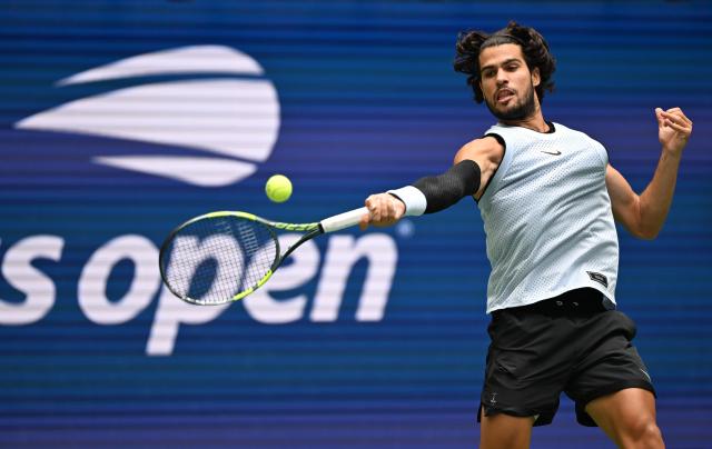 (260907) -- NEW YORK, Sept. 7, 2026 (Xinhua) -- Carlos Alcaraz of Spain hits a return during the men's singles fourth round match between Carlos Alcaraz of Spain and Tommy Paul of the United States, at the 2026 US Open tennis championships in New York, the United States, Sept. 6, 2026. (Xinhua/Li Rui)