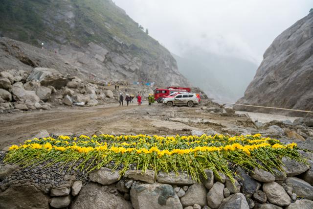 (260907) -- BEIJING, Sept. 7, 2026 (Xinhua) -- Flowers are laid at the core affected zone of the mudslide-hit Gyirong Port in southwest China's Xizang Autonomous Region, Sept. 6, 2026.
  China has deployed more than 2,500 rescue personnel after a mudslide struck Gyirong Port on the China-Nepal border in southwest China's Xizang Autonomous Region on Aug. 26, the emergency response and rescue headquarters said on Sunday. (Xinhua/Tenzin Nyida)