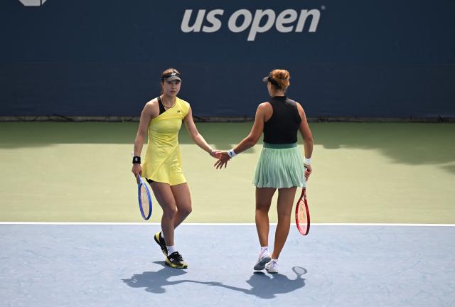 (260907) -- NEW YORK, Sept. 7, 2026 (Xinhua) -- Tang Qianhui (L)/Elena Pridankina celebrate scoring during the women's doubles second round match between Tang Qianhui (China)/Elena Pridankina (Russia) and Ellen Perez (Australia)/Demi Schuurs (the Netherlands) at the 2026 US Open tennis championships in New York, the United States, Sept. 5, 2026. (Xinhua/Li Rui)