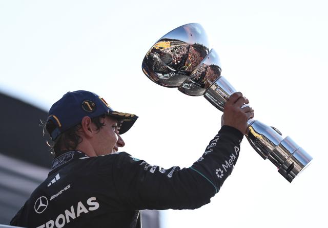 (260907) -- MONZA, Sept. 7, 2026 (Xinhua) -- Mercedes' driver Kimi Antonelli of Italy celebrates with the trophy after winning the Formula 1 Italian Grand Prix at Monza Circuit, near Milan, Italy, on Sept. 6, 2026. (Xinhua/Li Jing)