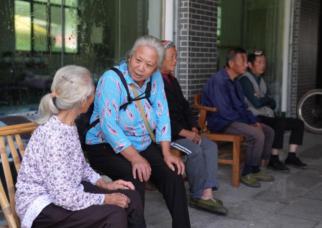 (260907) -- GANZHOU, Sept. 7, 2026 (Xinhua) -- Villagers from Mingkeng Village are pictured at a temporary relocation site in Xiangxing Village of Shangyou County, east China's Jiangxi Province, Sept. 7, 2026. Mingkeng Village of Gaoping Town in Suichuan County of Jiangxi Province was struck by a mudslide and landslide on Saturday. A total of 203 residents from the village have been transferred to a temporary relocation site in Xiangxing Village of Shangyou County, where they receive catering and medical services. (Xinhua/Wan Xiang)