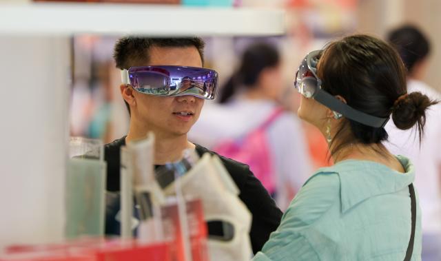 (260907) -- HAIKOU, Sept. 7, 2026 (Xinhua) -- Customers try products at a downtown duty-free store in Haikou, south China's Hainan Province, Aug. 29, 2026. Data from Haikou Customs showed that sales from offshore duty-free shopping across the island amounted to 3.82 billion yuan (about 569.22 million U.S. dollars) during this year's summer vacation period, up 4.1 percent from the same period last year. (Xinhua/Yang Guanyu)