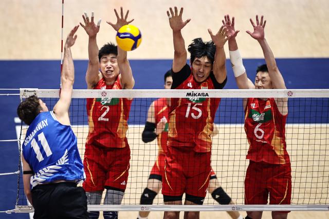 (260907) -- KITAKYUSHU, Sept. 7, 2026 (Xinhua) -- Jiang Chuan (2nd L), Peng Shikun (2nd R) and Yu Yuantai (1st R) of China block the ball during the pool B match between China and New Zealand at AVC Men's Volleyball Continental Championship in Kitakyushu, Japan, Sept. 7, 2026. (Xinhua/Jia Haocheng)