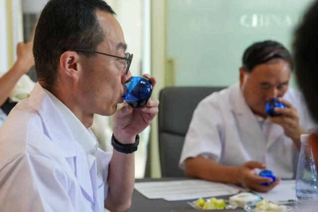 (260907) -- LONGNAN, Sept. 7, 2026 (Xinhua) -- Judges scrutinize olive oil samples submitted for the Australian International Olive Awards at a lab for sensory analysis in Longnan City, northwest China's Gansu Province, Sept. 6, 2026. The judging session for China division of the Australian International Olive Awards was held in Wudu District of Longnan on Sunday and Monday. The event has attracted entries from across the world to compete for the top award of olive oil.
   Dubbed the "hometown of China's olives," Wudu District boasts an olive planting area of 640,000 mu (about 42,667 hectares) with a total industrial output value exceeding 4 billion yuan (about 597 million U.S. dollars), and has formed a complete industrial chain from high-quality seed breeding to deep processing. (Xinhua/Lang Bingbing)