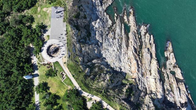 (260907) -- WEIHAI, Sept. 7, 2026 (Xinhua) -- An aerial drone photo taken on Sept. 7, 2026 shows people visiting the Liugong Island in Weihai City, east China's Shandong Province. (Xinhua/Zhu Zheng)