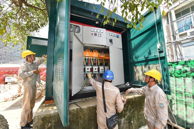(260907) -- PUTIAN, Sept. 7, 2026 (Xinhua) -- Electricians repair a power facility in Huating Town of Putian, southeast China's Fujian Province, Sept. 7, 2026. As heavy rainfall caused by Typhoon Saudel in Putian concluded on Saturday, floodwaters gradually receded in inundated areas of this city. Local authorities have since shifted to post-disaster recovery, undertaking tasks including water and power restoration, sanitation and disinfection, as well as the resettlement of affected residents. (Xinhua/Jiang Kehong)