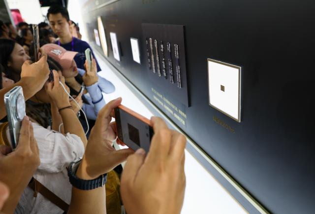 (260907) -- GUANGZHOU, Sept. 7, 2026 (Xinhua) -- People take photos of Huawei's Kirin 9050 Pro chip after a launch event in Guangzhou, south China's Guangdong Province, Sept. 7, 2026. Chinese tech giant Huawei on Monday launched the Mate XT 2 tri-fold smartphone powered by the new Kirin 9050 Pro chip, the first high-performance processor to use logic folding technology.
  The Kirin 9050 Pro stacks logic units in layers within a single chip, shortening signal transmission paths, reducing latency and boosting overall performance, according to a launch event in Guangzhou.
  The last time Huawei introduced a new Kirin chip at a flagship launch was at the global release of the Mate 40 smartphone six years ago. The company has continued to innovate and break new ground in recent years. (Xinhua/Mao Siqian)