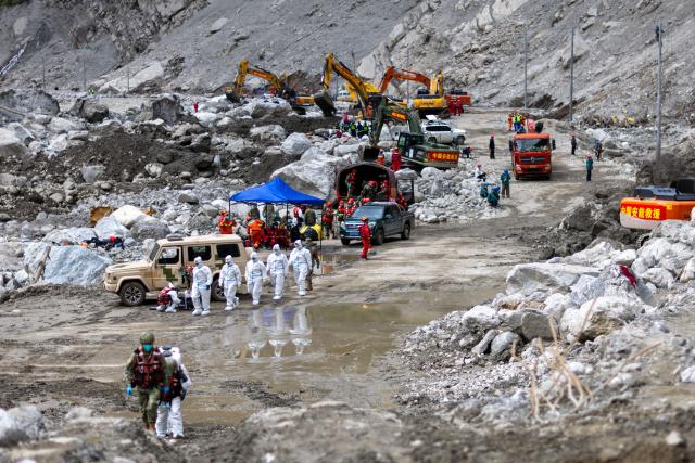 (260907) -- GYIRONG, Sept. 7, 2026 (Xinhua) -- Health workers prepare to carry out disinfection work at the mudslide-hit Gyirong Port in southwest China's Xizang Autonomous Region, Sept. 3, 2026. (Xinhua/Jiang Fan)