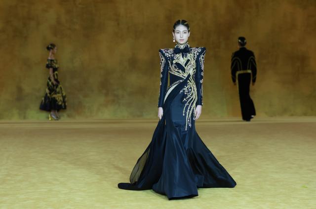 (260907) -- BEIJING, Sept. 7, 2026 (Xinhua) -- A model presents a creation as part of the latest Haute Couture collection by Chinese designer Laurence Xu during the opening ceremony of SS2027 Beijing Fashion Week in Beijing, capital of China, Sept. 7, 2026. SS2027 Beijing Fashion Week kicked off on Monday. (Xinhua/Gao Jing)