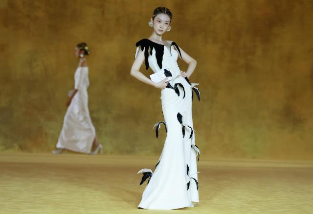 (260907) -- BEIJING, Sept. 7, 2026 (Xinhua) -- A model presents a creation as part of the latest Haute Couture collection by Chinese designer Laurence Xu during the opening ceremony of SS2027 Beijing Fashion Week in Beijing, capital of China, Sept. 7, 2026. SS2027 Beijing Fashion Week kicked off on Monday. (Xinhua/Gao Jing)