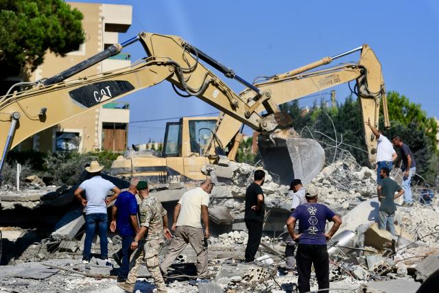 (260907) -- KFAR ROUMMANE, Sept. 7, 2026 (Xinhua) -- People inspect buildings destroyed by Israeli airstrikes in Kfar Roummane, Lebanon, Sept. 7, 2026. At least 11 people were killed and five others wounded in Israeli airstrikes on the town of Kfar Roummane in southern Lebanon early Monday, according to Lebanon's National News Agency (NNA). (Photo by Ali Hashisho/Xinhua)