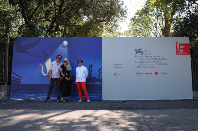 (260908) -- VENICE, Sept. 8, 2026 (Xinhua) -- People take photos with a poster of the 83rd Venice International Film Festival in Venice, Italy, Sept. 4, 2026. The 83rd Venice International Film Festival runs from Sept. 2 to 12 on the Venice Lido island in Italy. (Xinhua/Wang Kaiyan)