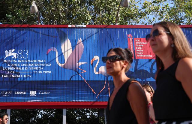 (260908) -- VENICE, Sept. 8, 2026 (Xinhua) -- People walk past a poster of the 83rd Venice International Film Festival in Venice, Italy, Sept. 5, 2026. The 83rd Venice International Film Festival runs from Sept. 2 to 12 on the Venice Lido island in Italy. (Xinhua/Wang Kaiyan)