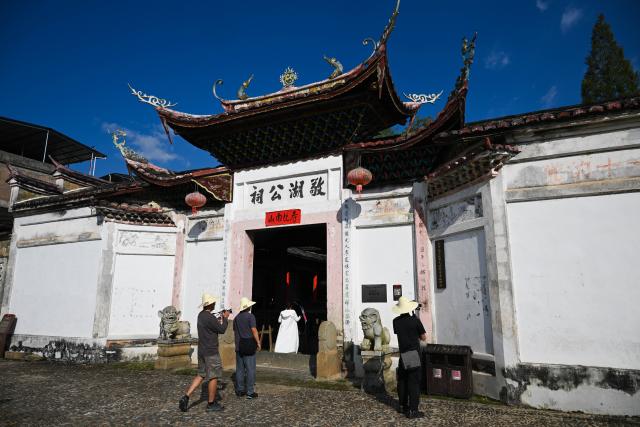 (260908) -- NINGHUA, Sept. 8, 2026 (Xinhua) -- People visit a village hall in Xiacao Village in Ninghua County, southeast China's Fujian Province, Sept. 8, 2026. This year marks the 90th anniversary of the victory of the Long March by the Red Army under the leadership of the Communist Party of China (CPC). Ninghua is one of the starting points of the Long March by the Central Red Army. Xiacao Village in Ninghua has profound heritage of revolutionary history. (Xinhua/Zheng Huansong)