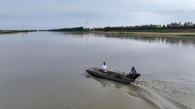 (260908) -- JINHU, Sept. 8, 2026 (Xinhua) -- A drone photo taken on May 29, 2026 shows Chen Fei (L), a teacher of Jinhu Special Education School, taking a boat to pay a home visit to a student in Jinhu County of Huai'an, east China's Jiangsu Province.
  In 2016, Jinhu Special Education School launched a home-based teaching program for children with severe disabilities. Over the past decade, teachers involved in the program have traveled nearly 80,000 kilometers across the county to teach students in their homes.
  For each child, the teachers develop an individualized education plan covering cognitive development, daily living skills and rehabilitation training, while also providing families with parenting and caregiving guidance. Through patience and consistent efforts, they have gradually earned the children's trust and helped many of them make notable progress.
  Over the past 10 years, eight children have successfully made the transition from home-based education to attending school. A total of 42 children with severe disabilities have received systematic education and rehabilitation services. (Photo by Liang Debin/Xinhua)