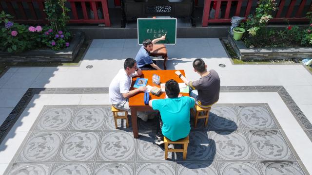 (260908) -- JINHU, Sept. 8, 2026 (Xinhua) -- Yang Jinlong (top), a teacher of Jinhu Special Education School, teaches students in Jinhu County of Huai'an, east China's Jiangsu Province, May 29, 2026.
  In 2016, Jinhu Special Education School launched a home-based teaching program for children with severe disabilities. Over the past decade, teachers involved in the program have traveled nearly 80,000 kilometers across the county to teach students in their homes.
  For each child, the teachers develop an individualized education plan covering cognitive development, daily living skills and rehabilitation training, while also providing families with parenting and caregiving guidance. Through patience and consistent efforts, they have gradually earned the children's trust and helped many of them make notable progress.
  Over the past 10 years, eight children have successfully made the transition from home-based education to attending school. A total of 42 children with severe disabilities have received systematic education and rehabilitation services. (Photo by Liang Debin/Xinhua)