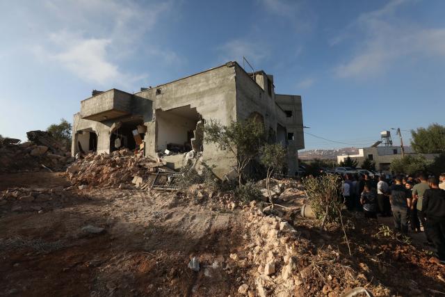 (260908) -- NABLUS, Sept. 8, 2026 (Xinhua) -- Palestinians inspect a building after the Israeli forces destroyed it, in the town of Aqraba, south of Nablus in the West Bank, on Sept. 8, 2026. A Palestinian man was killed by Israeli army fire on Tuesday in the town of Aqraba, south of Nablus in the northern West Bank. (Photo by Nidal Eshtayeh/Xinhua)