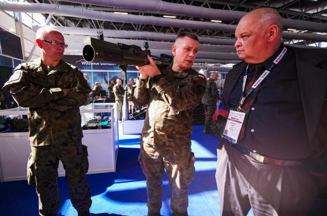 (260908) -- KIELCE, Sept. 8, 2026 (Xinhua) -- A visitor learn about a piece of equipment during the 34th International Defence Industry Exhibition in Kielce, Poland, Sept. 8, 2026. The event runs from Sept. 8 to 11, showcasing the latest defence equipment and technologies as well as solutions for communications, security, logistics and rescue. (Photo by Jaap Arriens/Xinhua)
