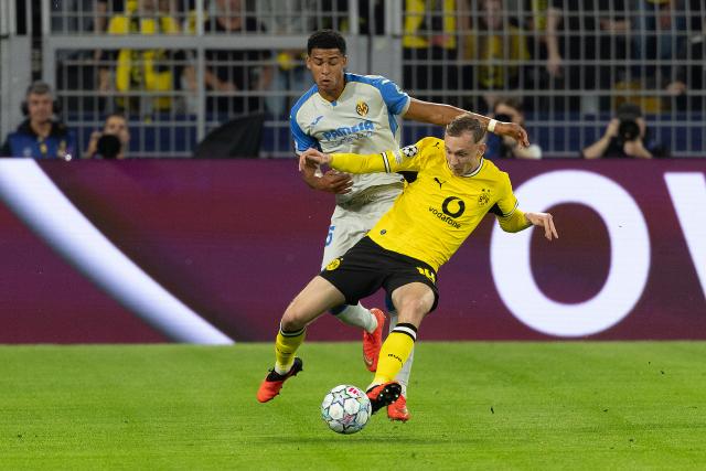 (260909) -- DORTMUND, Sept. 9, 2026 (Xinhua) -- Maximilian Beier (R) of Borussia Dortmund vies with Santiago Mourino of Villarreal during the UEFA Champions League football match between Borussia Dortmund and Villarreal in Dortmund, Germany, Sept. 8, 2026. (Photo by Joachim Bywaletz/Xinhua)
