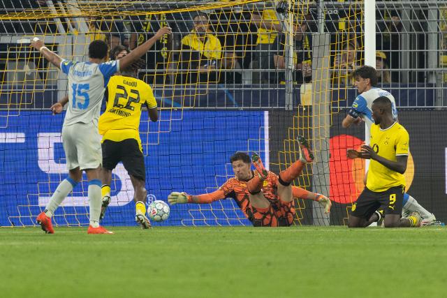 (260909) -- DORTMUND, Sept. 9, 2026 (Xinhua) -- Serhou Guirassy (1st R) of Borussia Dortmund scores an own goal during the UEFA Champions League football match between Borussia Dortmund and Villarreal in Dortmund, Germany, Sept. 8, 2026. (Photo by Joachim Bywaletz/Xinhua)