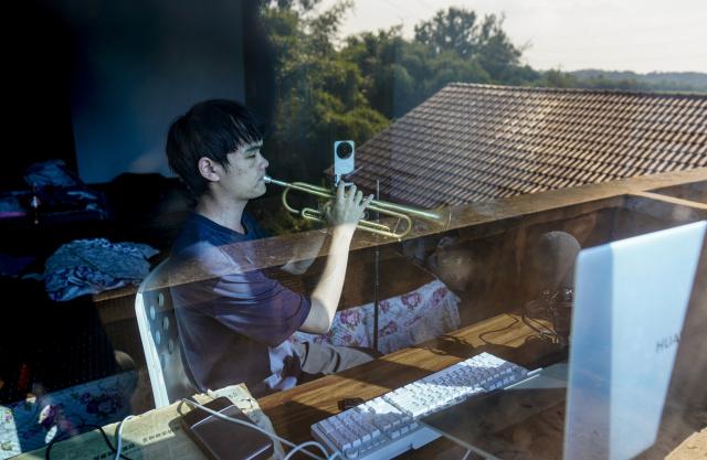 (260909) -- BEIJING, Sept. 9, 2026 (Xinhua) -- Wang Taifan practices playing a trumpet at home in Shuangsheng Village of Tongliang District, southwest China's Chongqing Municipality, Sept. 5, 2026. Wang Taifan, who took part in the performance of the Paralympic Anthem at the opening ceremony of the Beijing 2022 Paralympic Winter Games, recently began his college life as a musicology freshman at the Special Education College of Beijing Union University. 
  Born in Tongliang District of southwest China's Chongqing, Wang lost his sight at the age of 12 due to an eye disease. After enrolled in the Chongqing Special Education Center, he learned to play the trumpet with the help of his teachers and joined a wind ensemble composed of vision limited individuals. The trumpet enabled Wang to experience a wider world as he traveled to many cities and stepped onto bigger stages with his bandmates. As a new chapter of his life begins, Wang looks forward to a solo concert of his own. (Xinhua/Liu Chan)